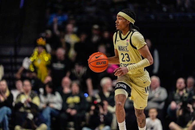 Feb 26, 2025; Winston-Salem, North Carolina, USA; Wake Forest Demon Deacons guard Hunter Sallis (23) brings the ball up court against the Virginia Cavaliers during the first half at Lawrence Joel Veterans Memorial Coliseum. Mandatory Credit: Jim Dedmon-Imagn Images